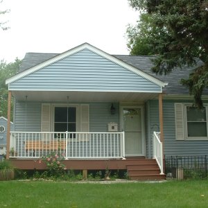 New-front-porch-addition-with-composite-decking-and-aluminum-railing -n-Hopkins